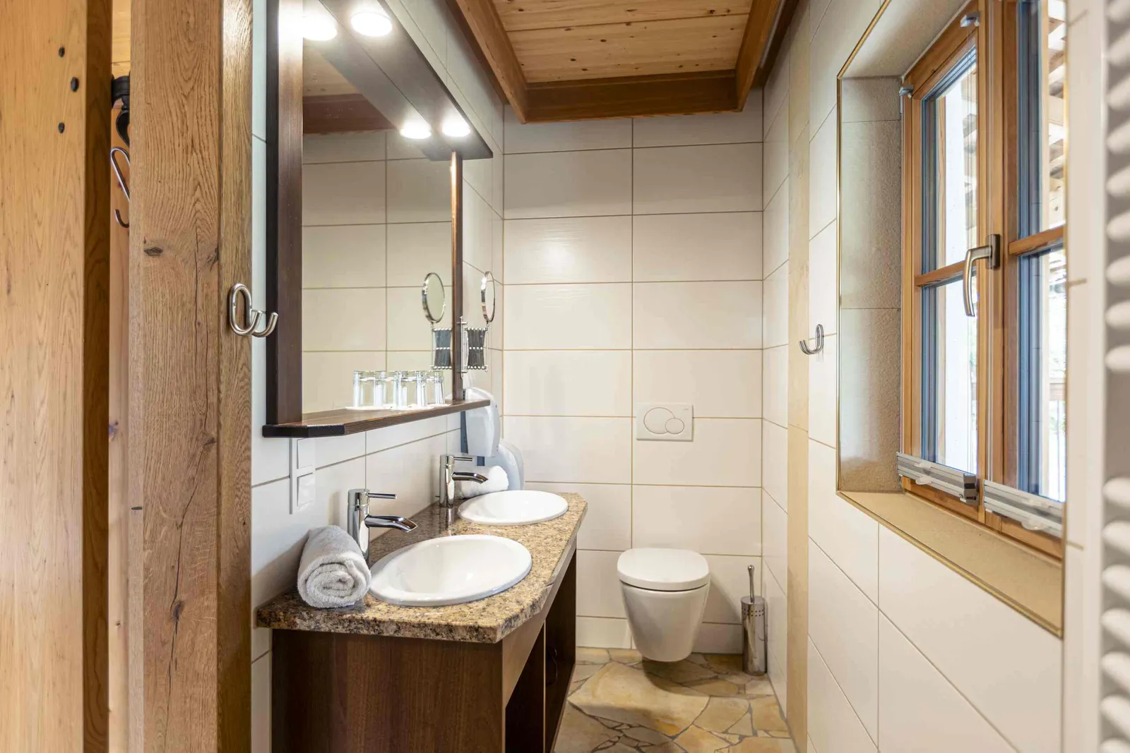 Modern apartment bathroom with shower and vanity in Samspitze 4
