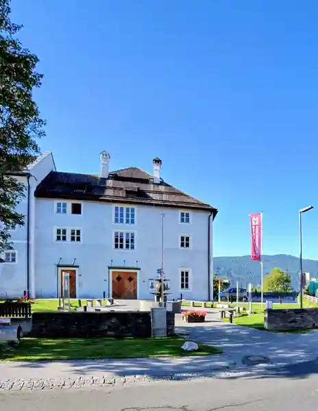 Historic museum building in Mariapfarr under a clear blue sky.